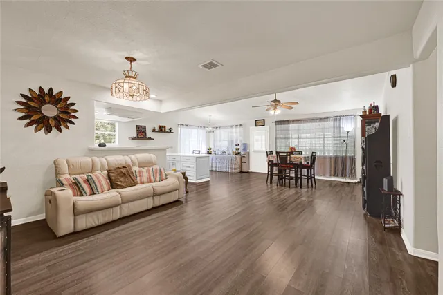 a view of a dining room with furniture and wooden floor
