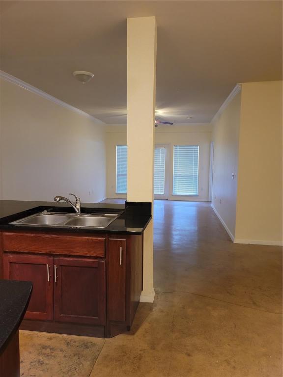 910 West 25th Street, Unit 305 Austin, TX 78705 - Photo 3 of 10 a kitchen with a sink a stove cabinets and wooden floor