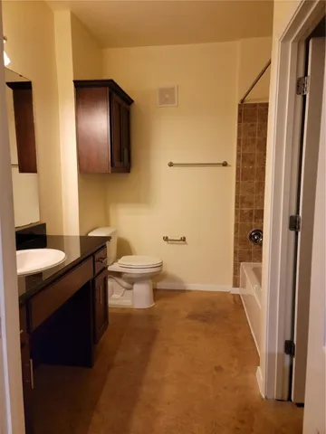 an empty room with a fan