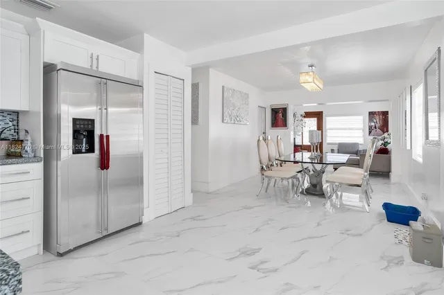 a view of a livingroom with furniture and a window