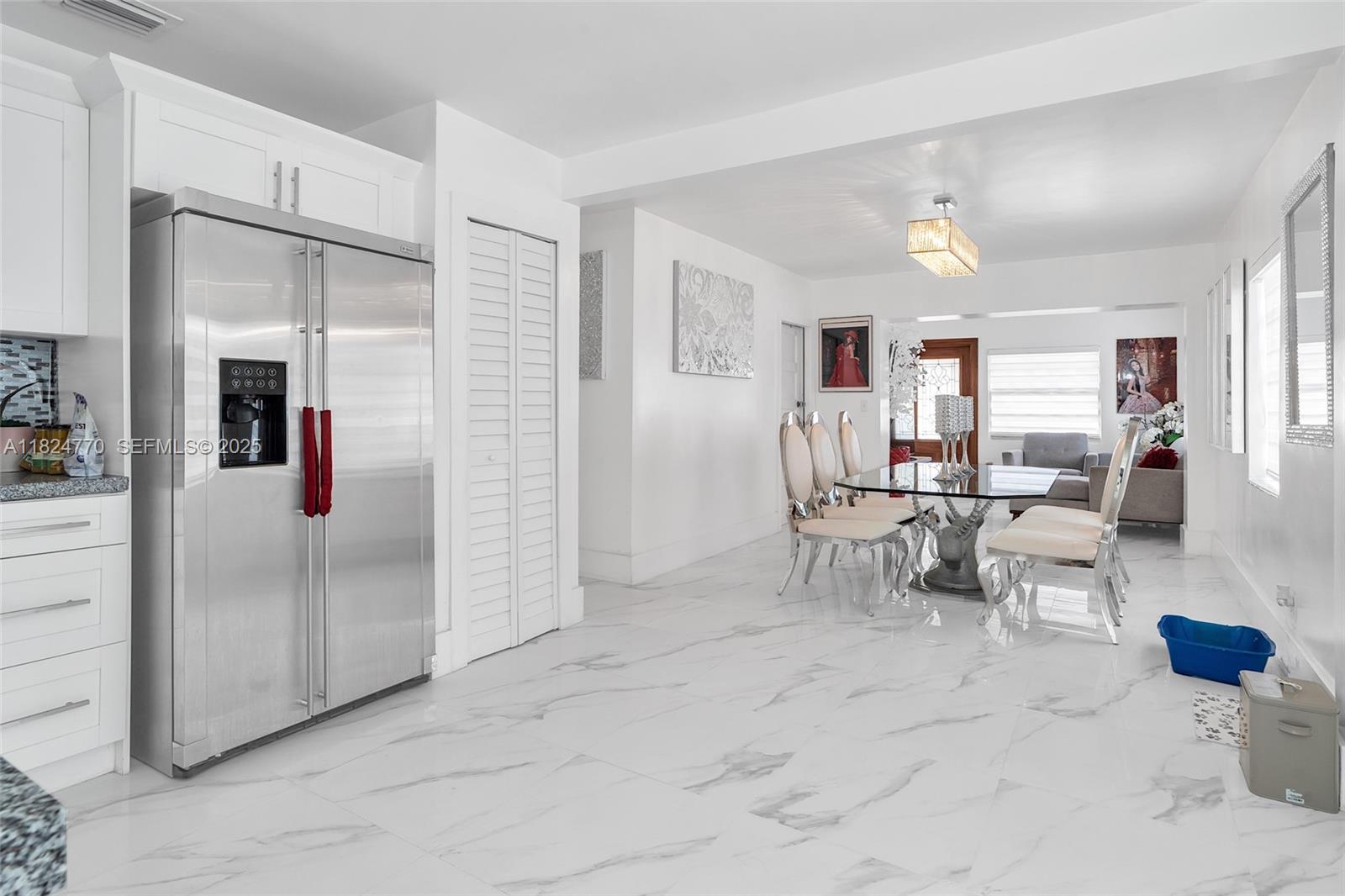 31 Southwest 58th Court Miami, FL 33144 - Photo 19 of 41 a view of a livingroom with furniture and a window