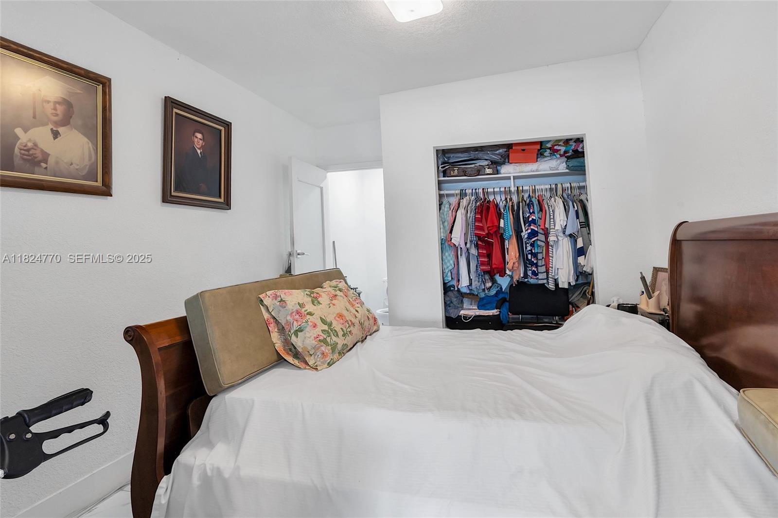 31 Southwest 58th Court Miami, FL 33144 - Photo 20 of 41 a bed room with a bed and a chair