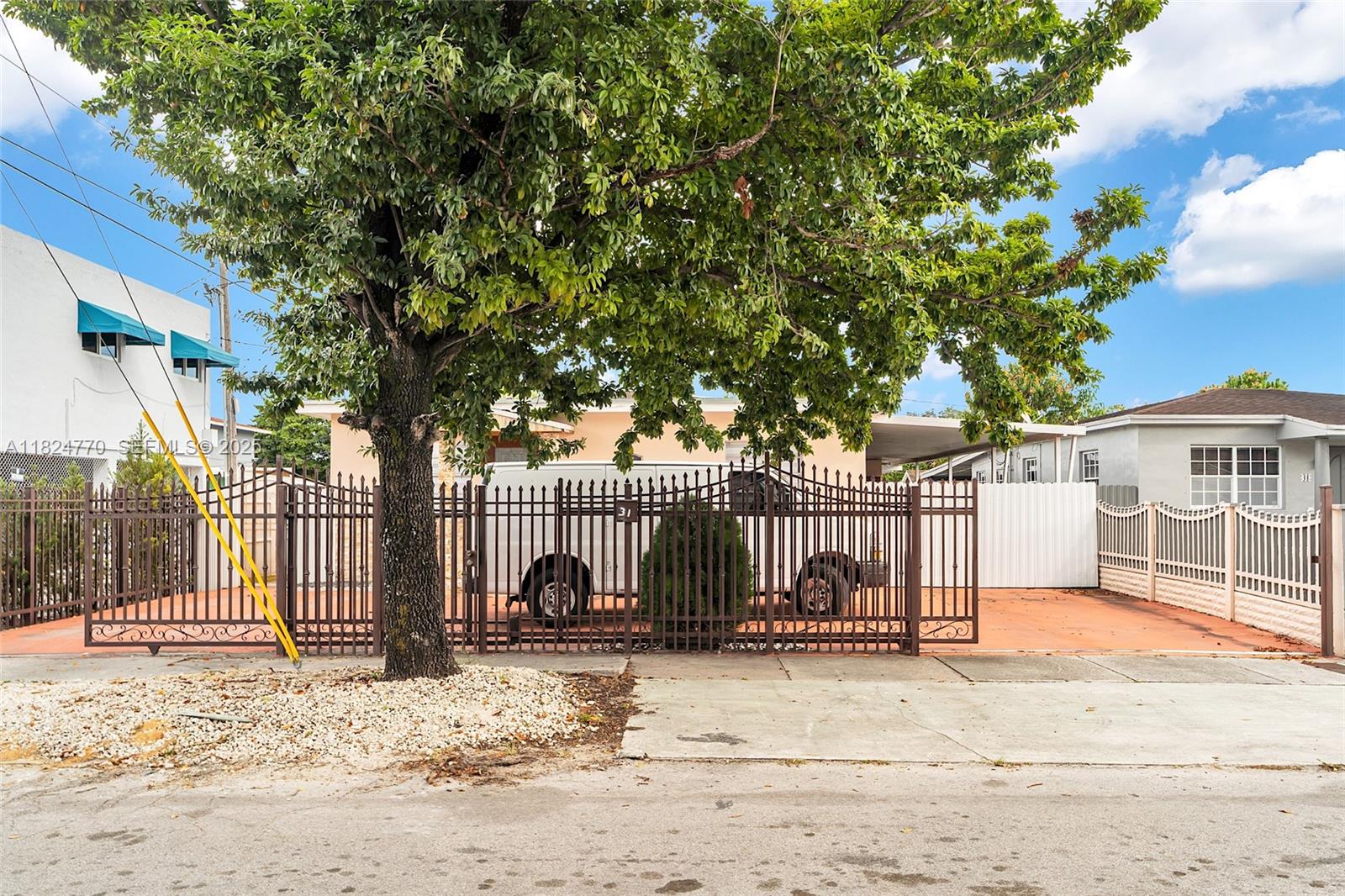 31 Southwest 58th Court Miami, FL 33144 - Photo 2 of 41 a view of a house with a snow in the yard