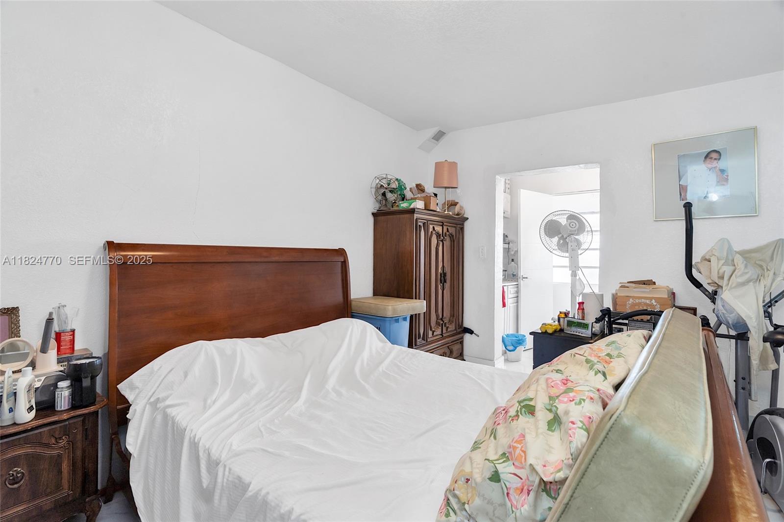 31 Southwest 58th Court Miami, FL 33144 - Photo 22 of 41 a bed sitting in a bedroom and chair