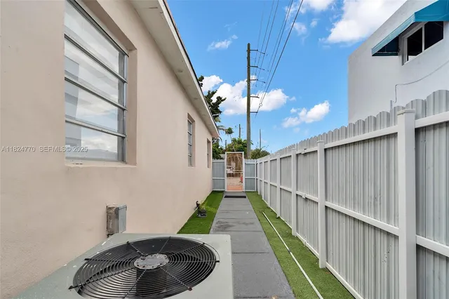 a view of a porch with furniture and front door