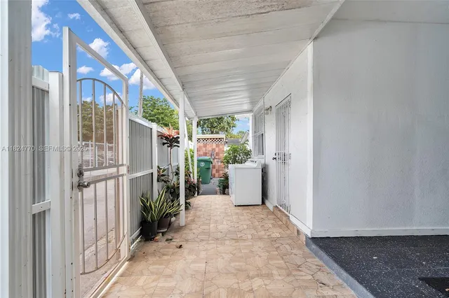 a view of a livingroom with furniture and front door