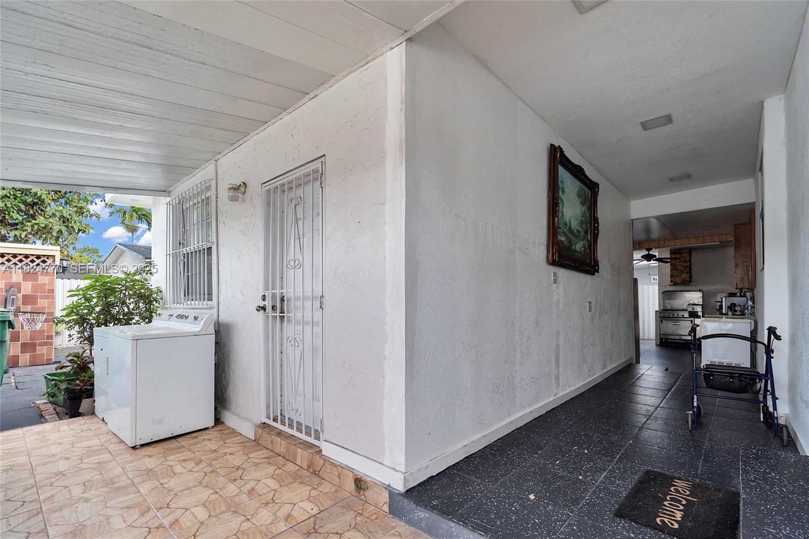 31 Southwest 58th Court Miami, FL 33144 - Photo 25 of 41 a view of a livingroom with furniture and front door