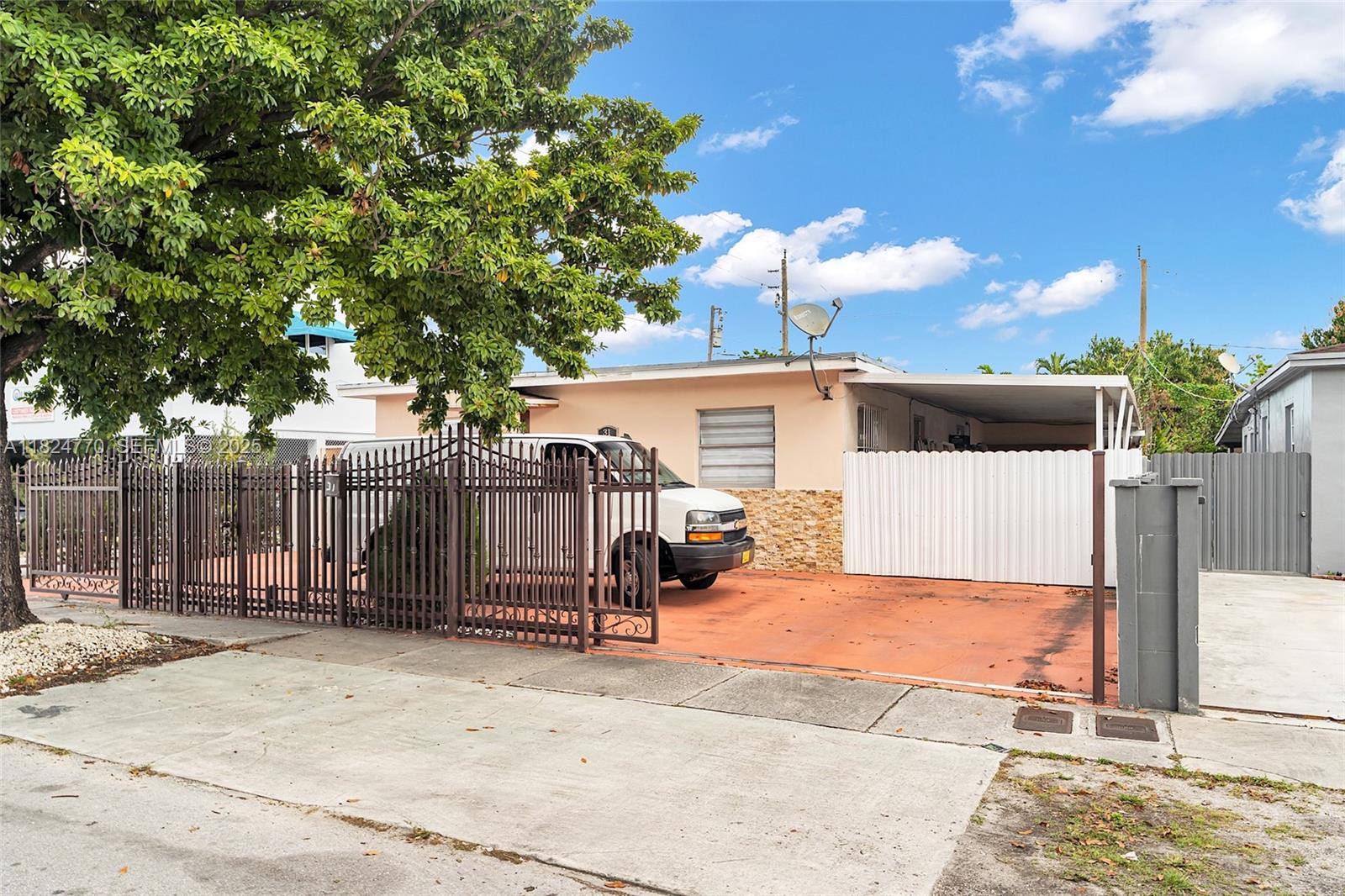 31 Southwest 58th Court Miami, FL 33144 - Photo 3 of 41 a view of a house with a backyard