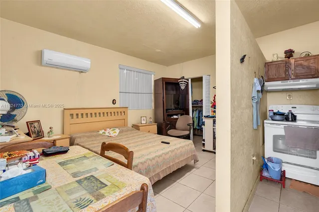 a kitchen with a sink a stove and a refrigerator