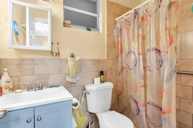 a bedroom with a bed and a table in it