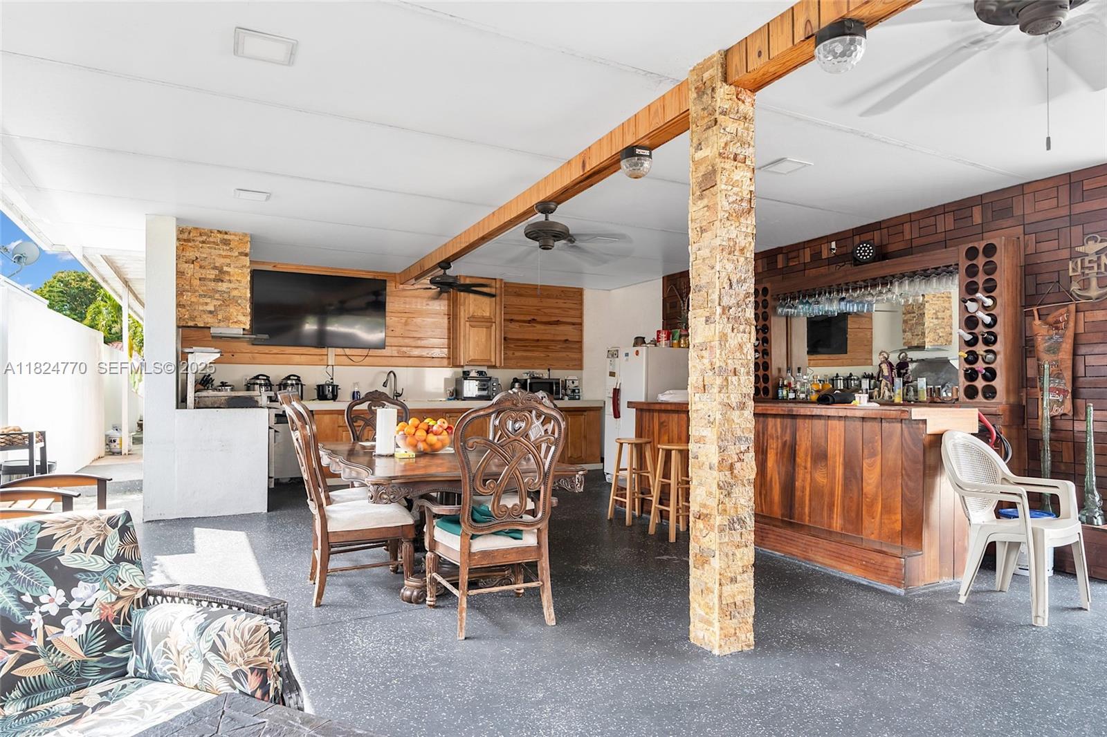31 Southwest 58th Court Miami, FL 33144 - Photo 37 of 41 a living room with lots of furniture and kitchen view
