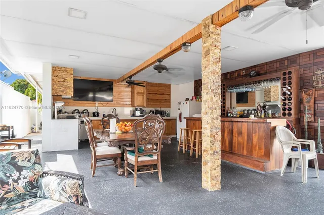 a view of a dining room with furniture wooden floor and chandelier