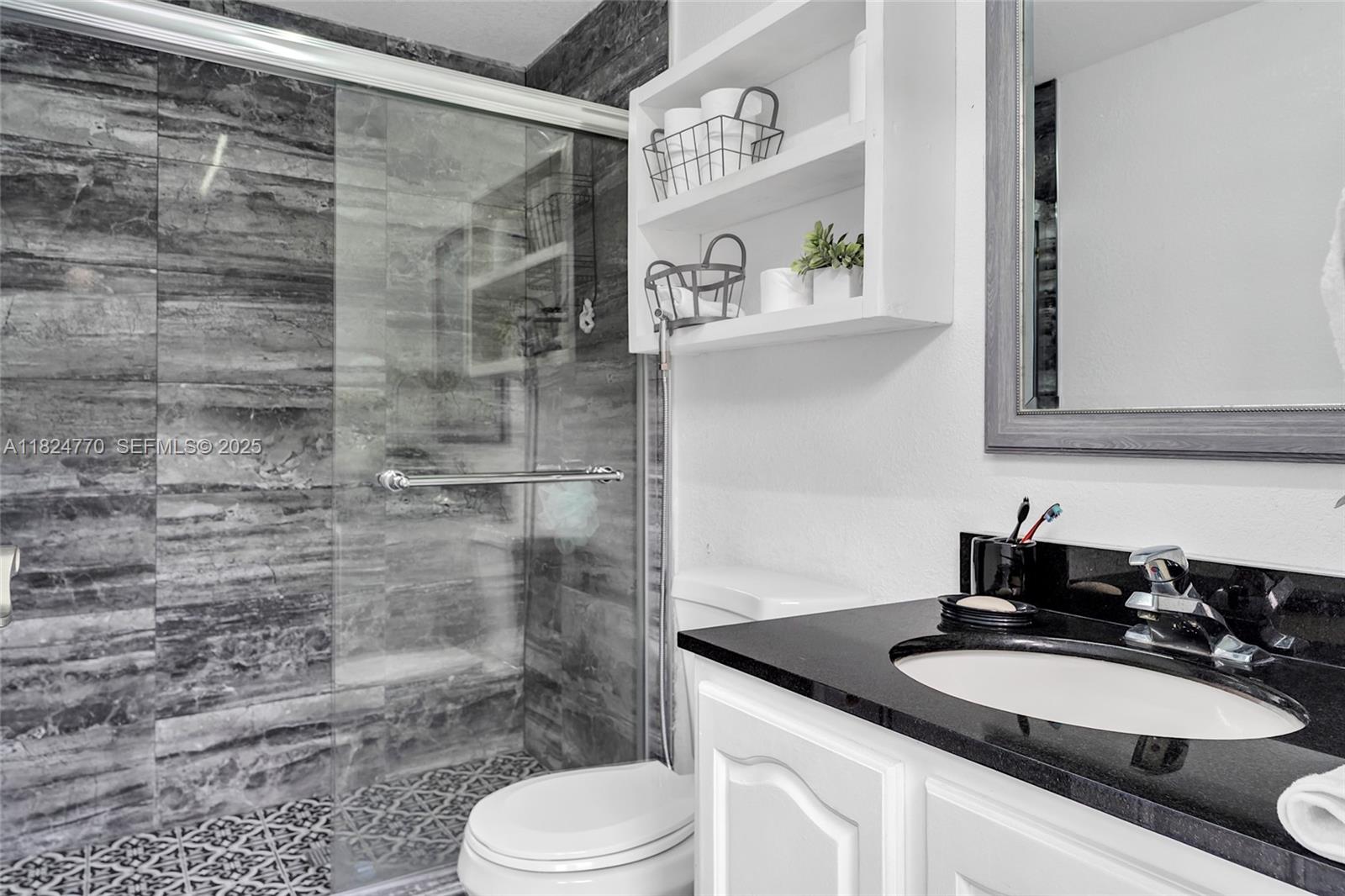 31 Southwest 58th Court Miami, FL 33144 - Photo 41 of 41 a bathroom with a sink a toilet and shower