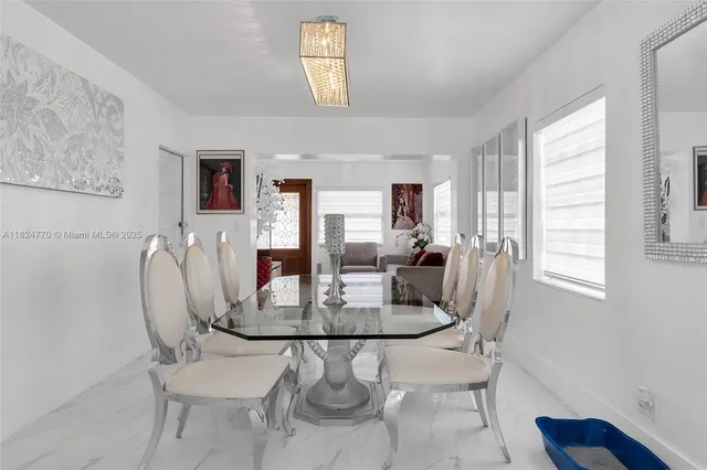 a dining room with furniture and window