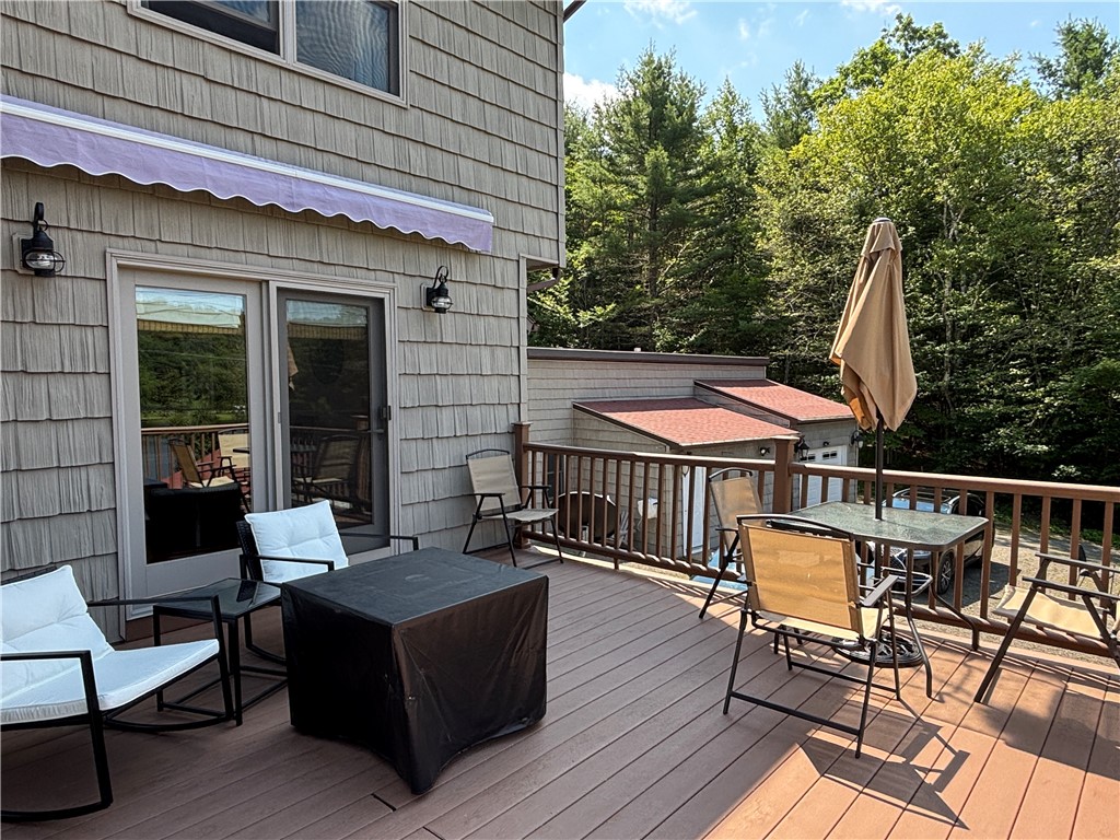 179 Sparrowhawk Lake Road Maryland, NY 12155 - Photo 35 of 49 Deck outside with awning overlooking the lake