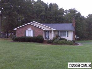 2510 Honeycutt-Simpson Road Monroe, NC 28110 - Photo 1 of 1 a front view of a house with a yard and garage