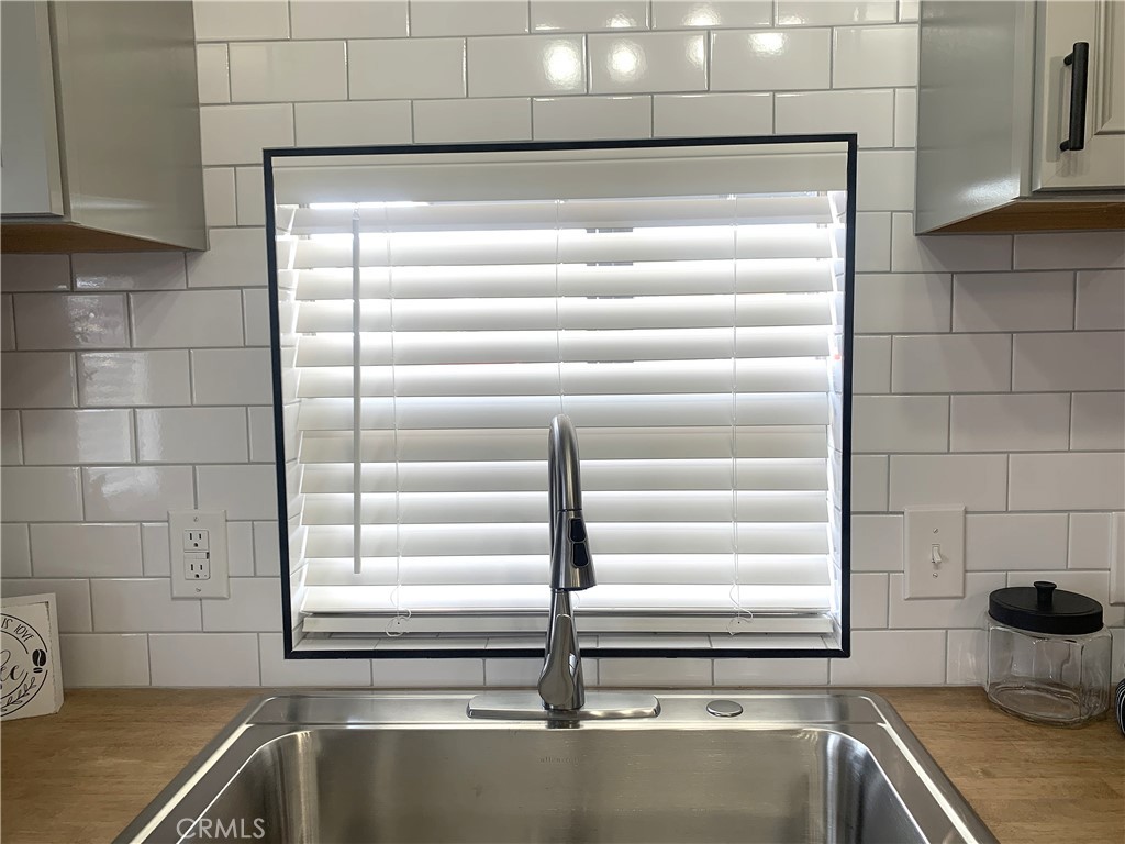 975 California Street, Unit 72 Calimesa, CA 92320 - Photo 13 of 23 a kitchen with a sink and a window