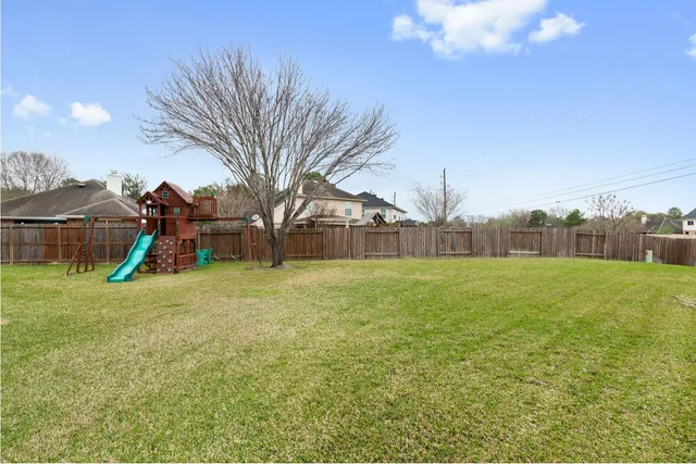 a childrens park with lots of swings and slides