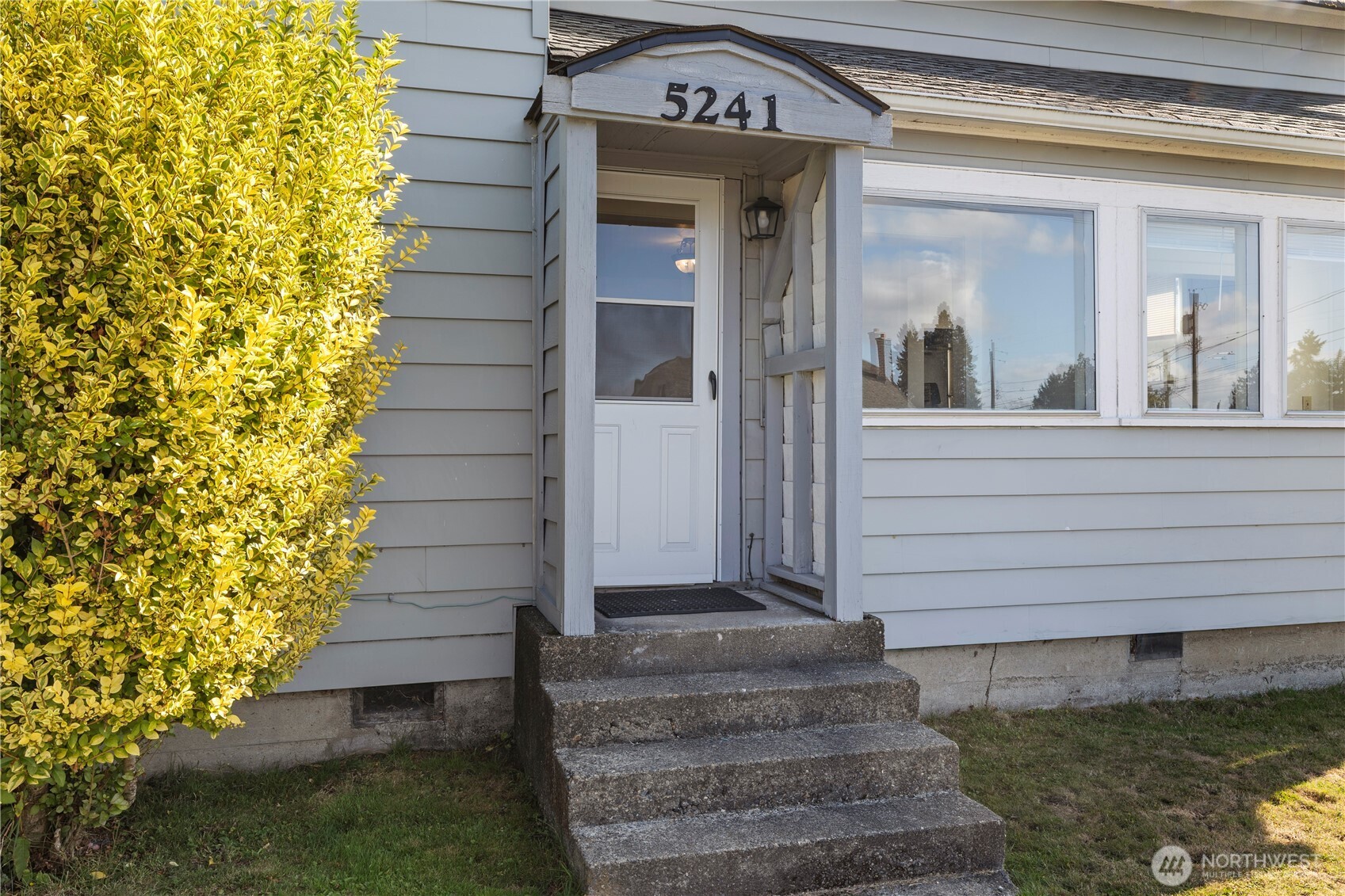5241 South M Street, Unit AB Tacoma, WA 98408 - Photo 3 of 27 a view of a house with a door and a window