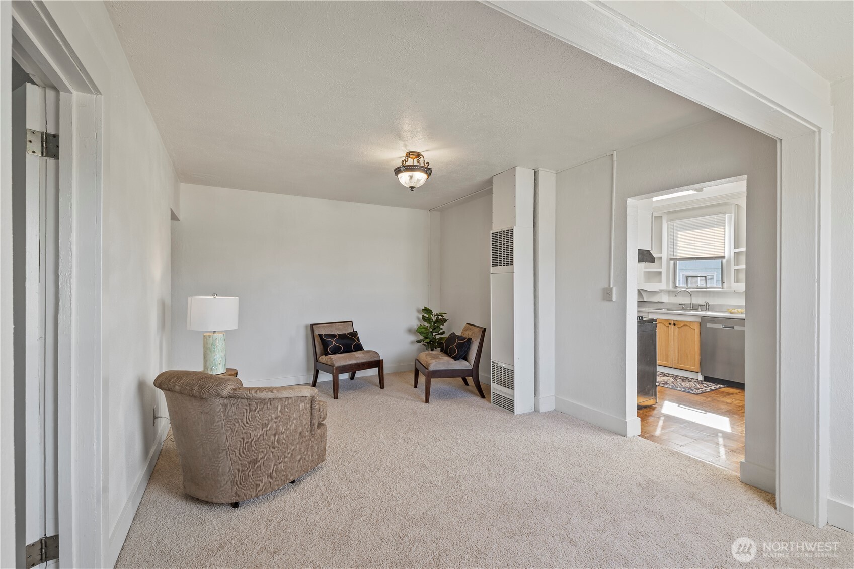 5241 South M Street, Unit AB Tacoma, WA 98408 - Photo 5 of 27 a living room with furniture and a table