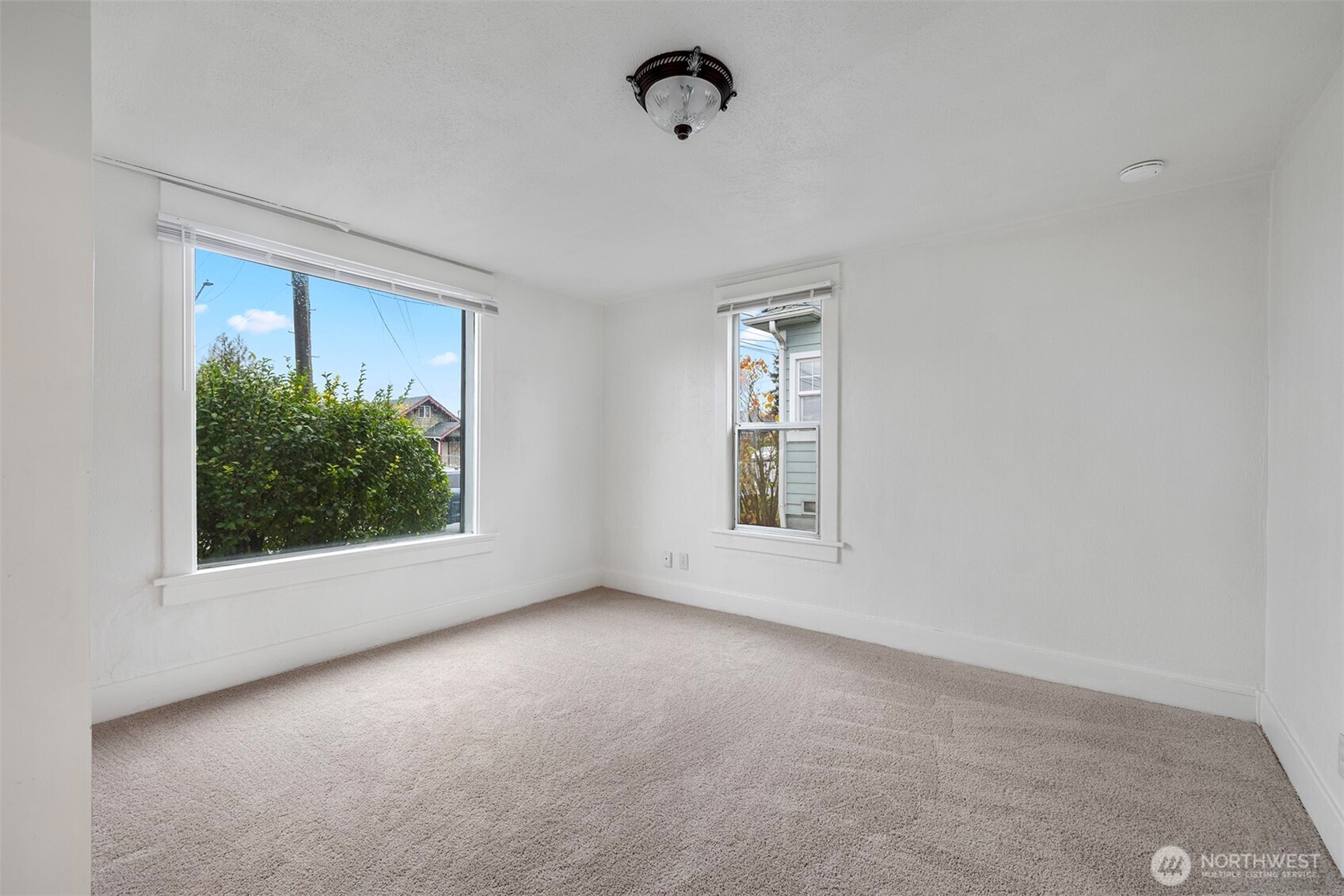 5241 South M Street, Unit AB Tacoma, WA 98408 - Photo 8 of 27 an empty room with windows