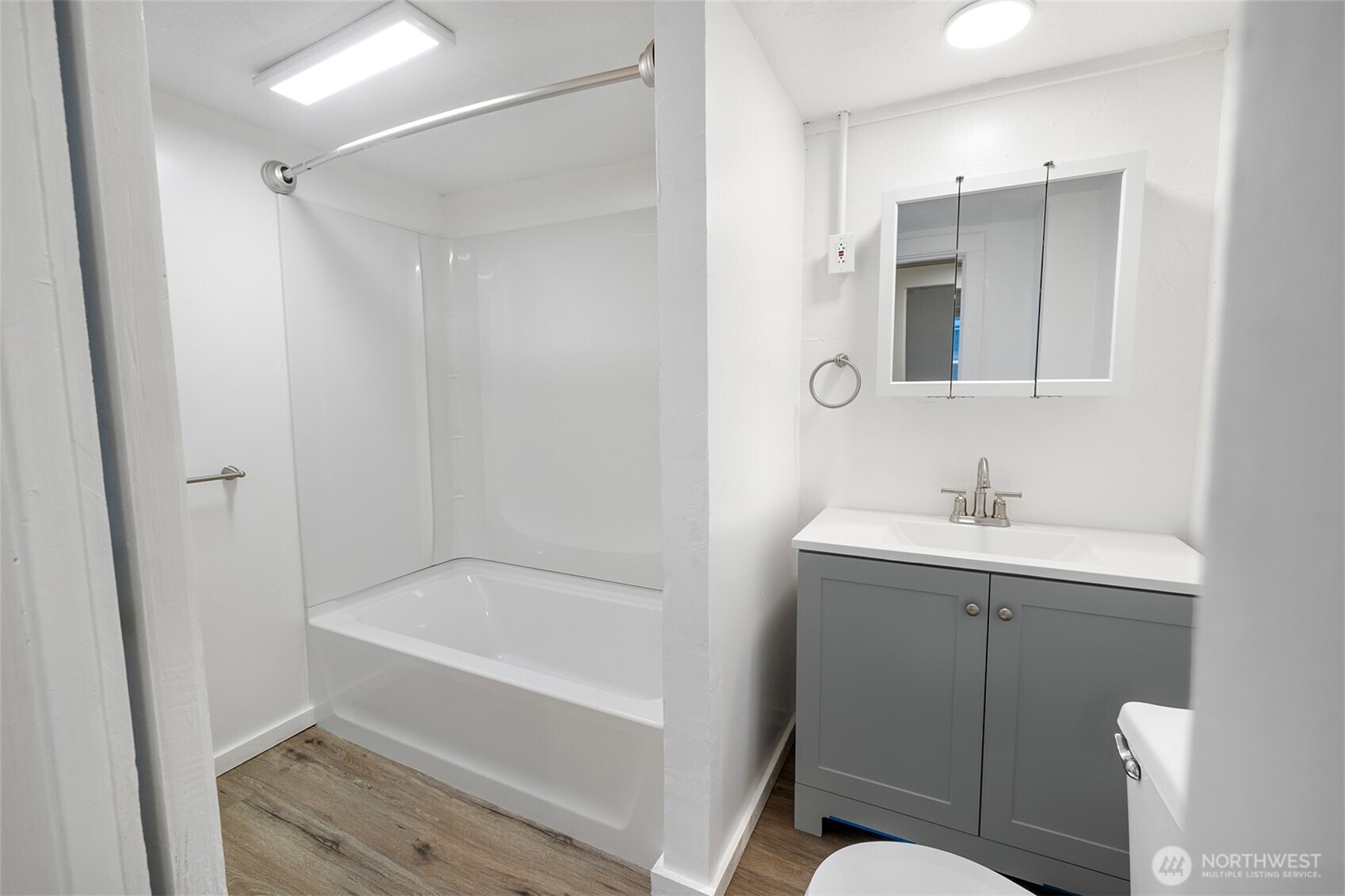 5241 South M Street, Unit AB Tacoma, WA 98408 - Photo 10 of 27 a bathroom with a sink mirror toilet and bathtub