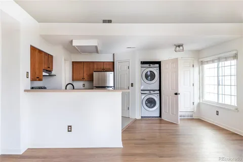 a view of a livingroom with furniture and wooden floor