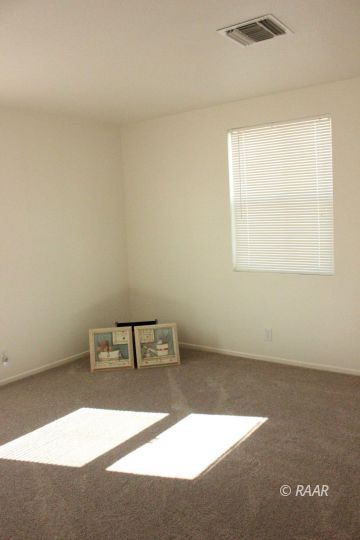 325 North Norma Street Ridgecrest, CA 93555 - Photo 22 of 25 an empty room with a window