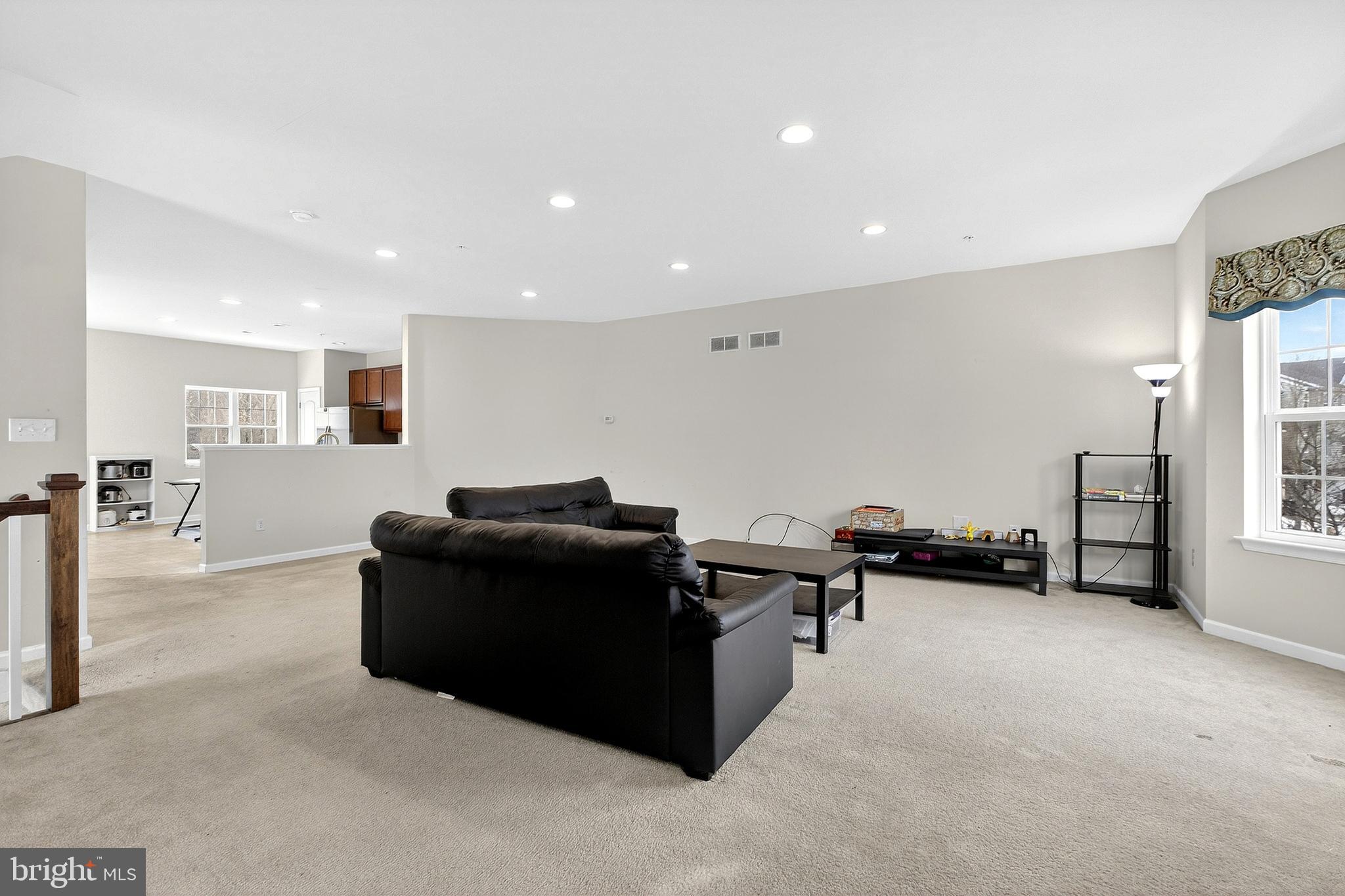48 Munro Road Newark, DE 19711 - Photo 11 of 50 a living room with furniture and a flat screen tv