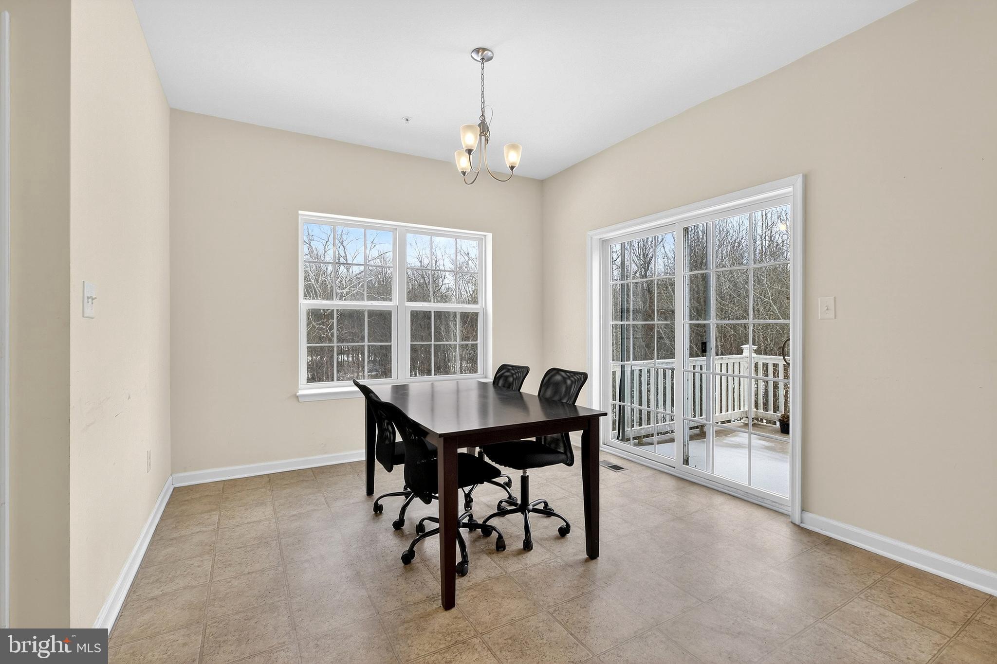 48 Munro Road Newark, DE 19711 - Photo 15 of 50 a view of a dining room with furniture window and outside view
