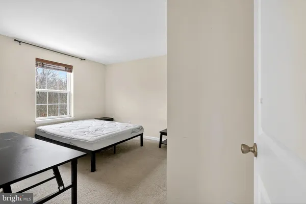 a room that has a table and chairs in it