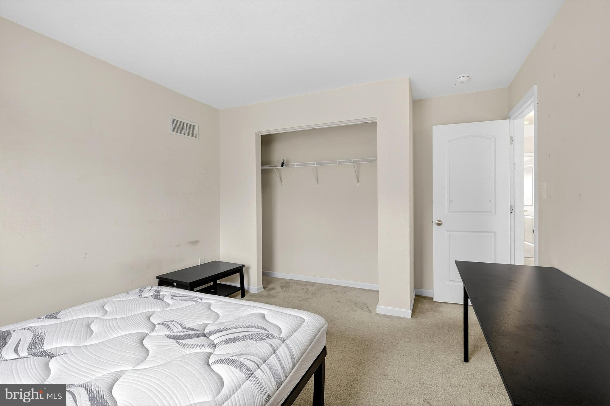 48 Munro Road Newark, DE 19711 - Photo 25 of 50 a bedroom with a bed and a chair