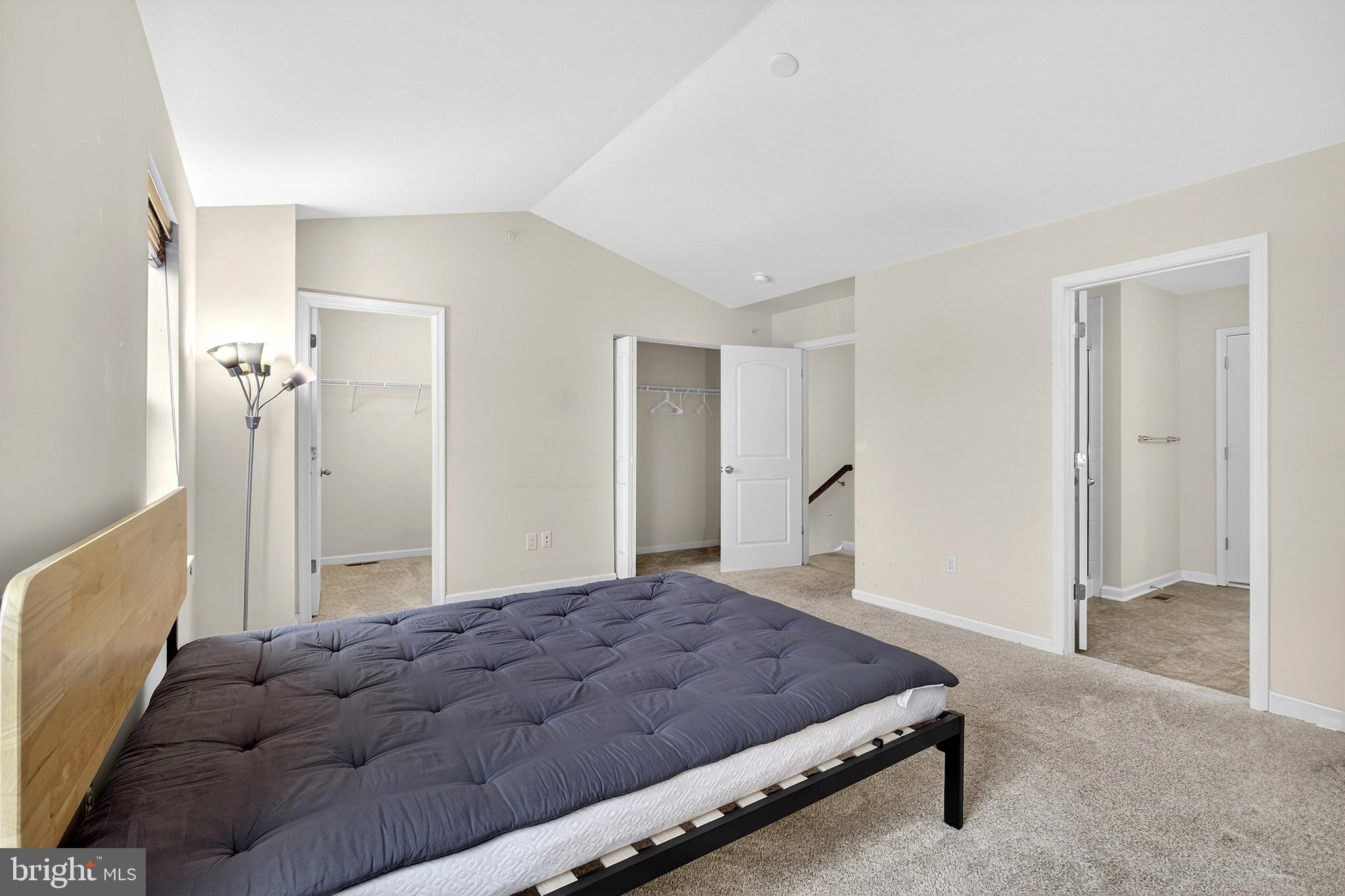 48 Munro Road Newark, DE 19711 - Photo 30 of 50 a bedroom with a bed and a refrigerator