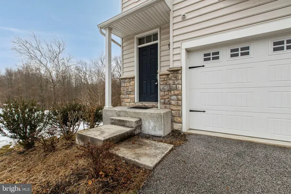a view of a patio with couches table and chairs and potted plants