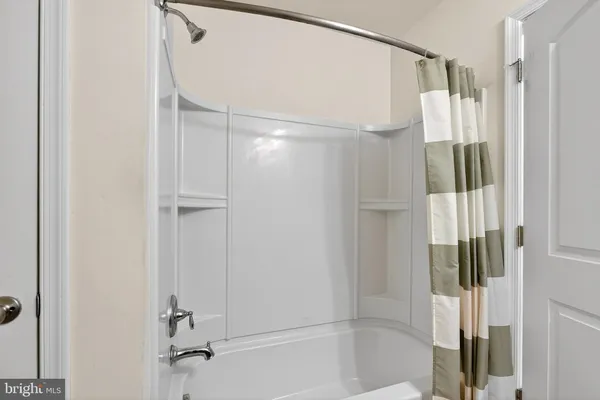 a bathroom with a sink and a shower