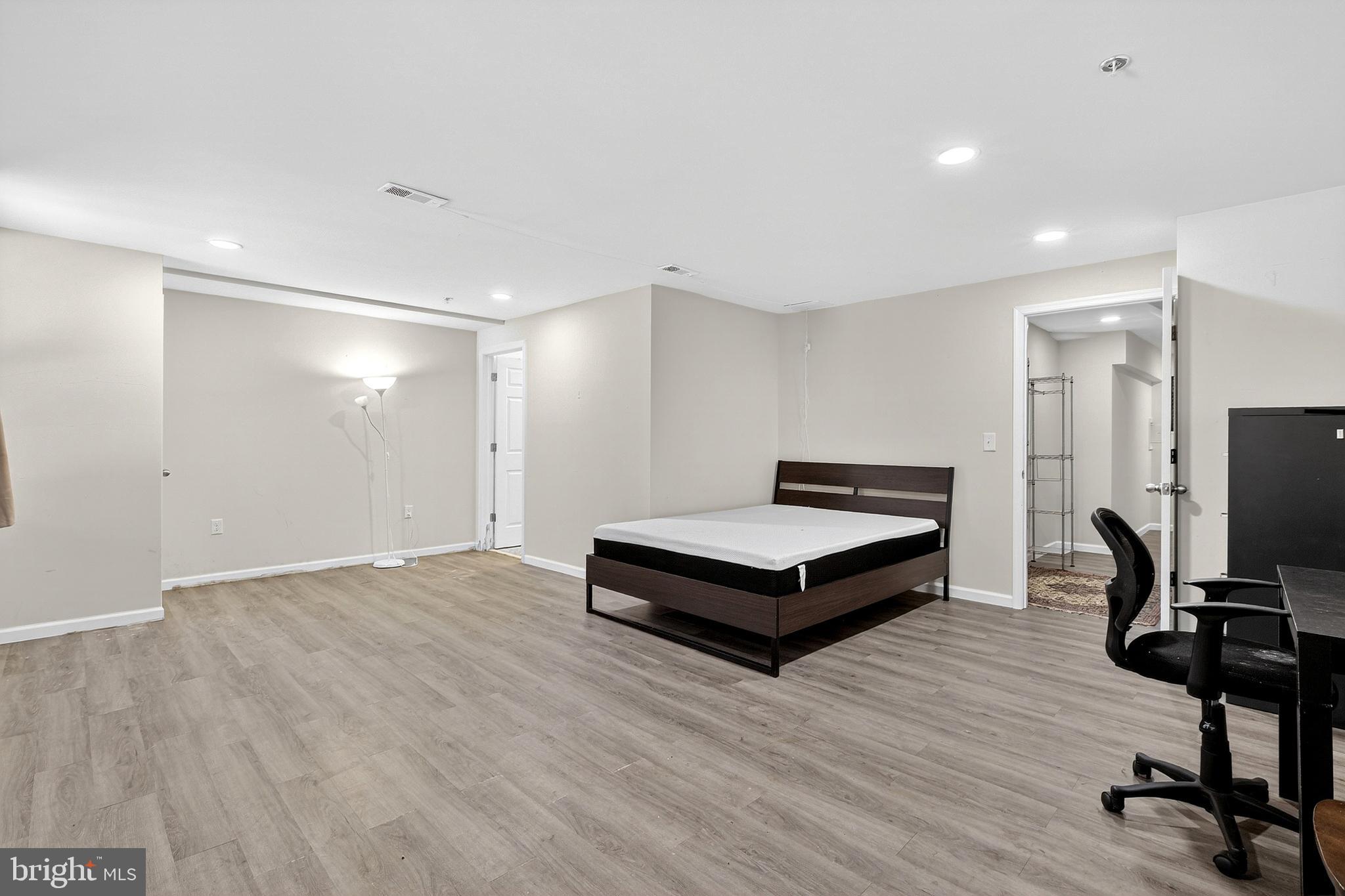 48 Munro Road Newark, DE 19711 - Photo 41 of 50 a spacious bedroom with a bed and a flat screen tv