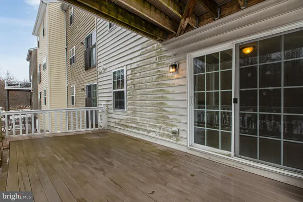 a view of balcony with wooden floor