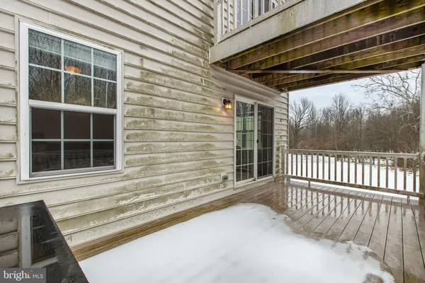 a view of balcony with wooden floor