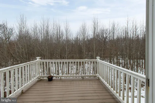 a view of a house with a snow in the background