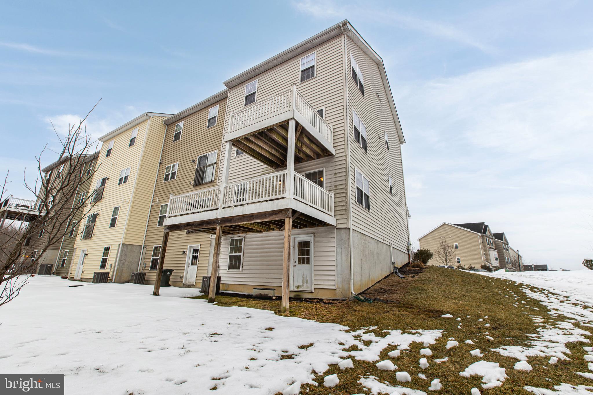48 Munro Road Newark, DE 19711 - Photo 48 of 50 a view of a house with a snow in the background