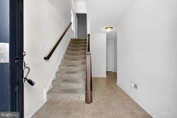a view of a hallway with staircase