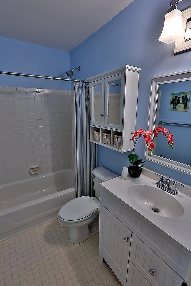 8536 Yucca Trail Raleigh, NC 27615 - Photo 10 of 23 Just painted bathroom is fresh & clean with new lighting and mirror. Upstairs bathroom