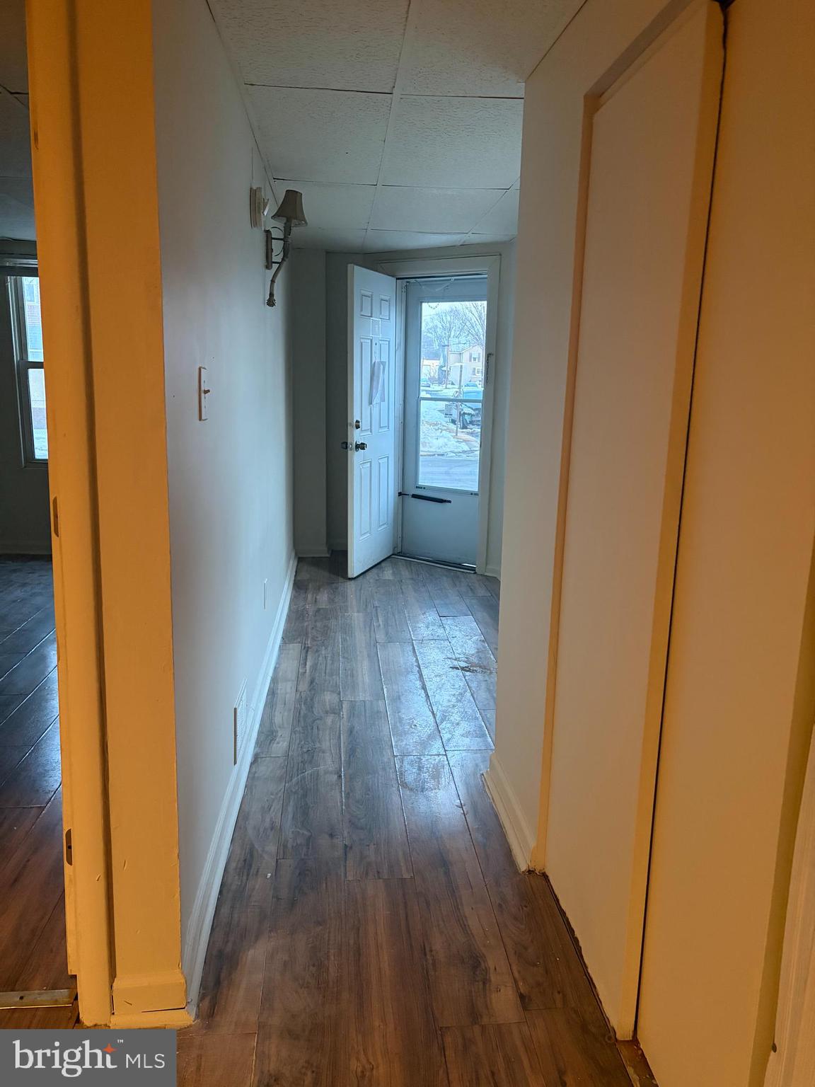 231 Broad Street, Unit C Beverly, NJ 08010 - Photo 4 of 7 a view of hallway with wooden floor