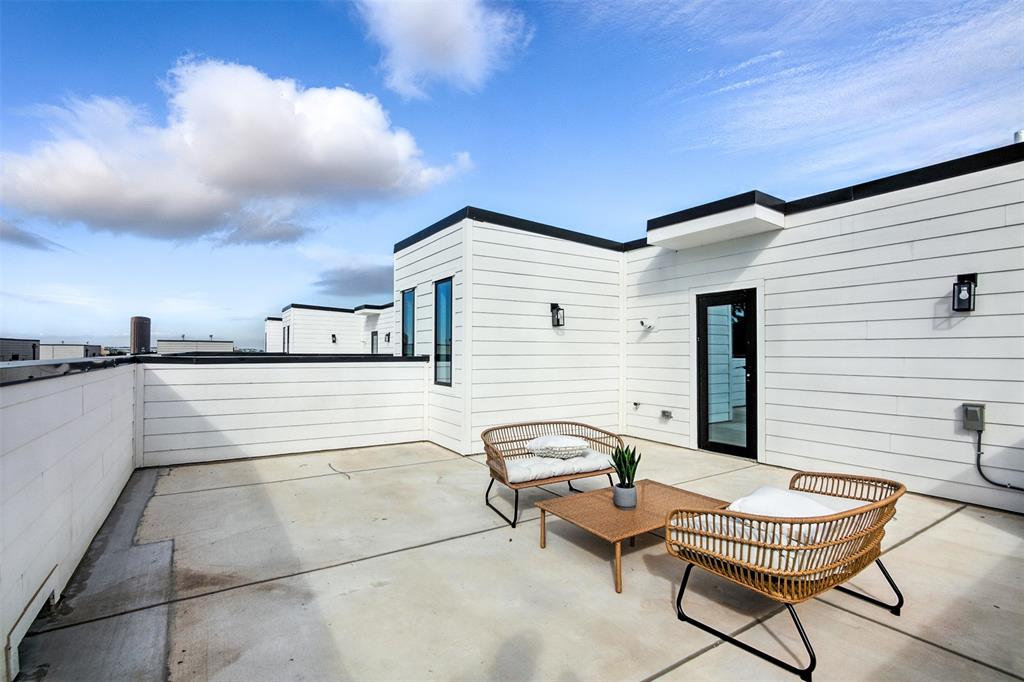 4611 Fairmount Street, Unit 105 Dallas, TX 75219 - Photo 2 of 20 a view of a terrace with chairs