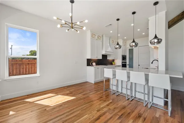 a view of kitchen with wooden floor and window