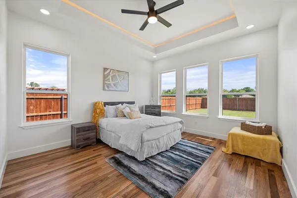 a living room with a bed furniture and a window