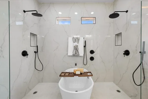 a bathroom with a shower a toilet and a shower
