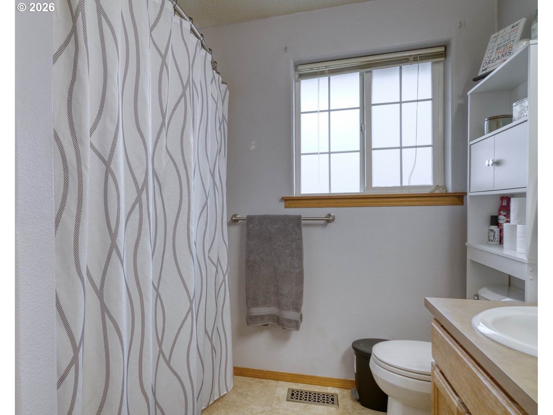 435 South 8th Street St. Helens, OR 97051 - Photo 15 of 39 a bathroom with a toilet and a shower curtain