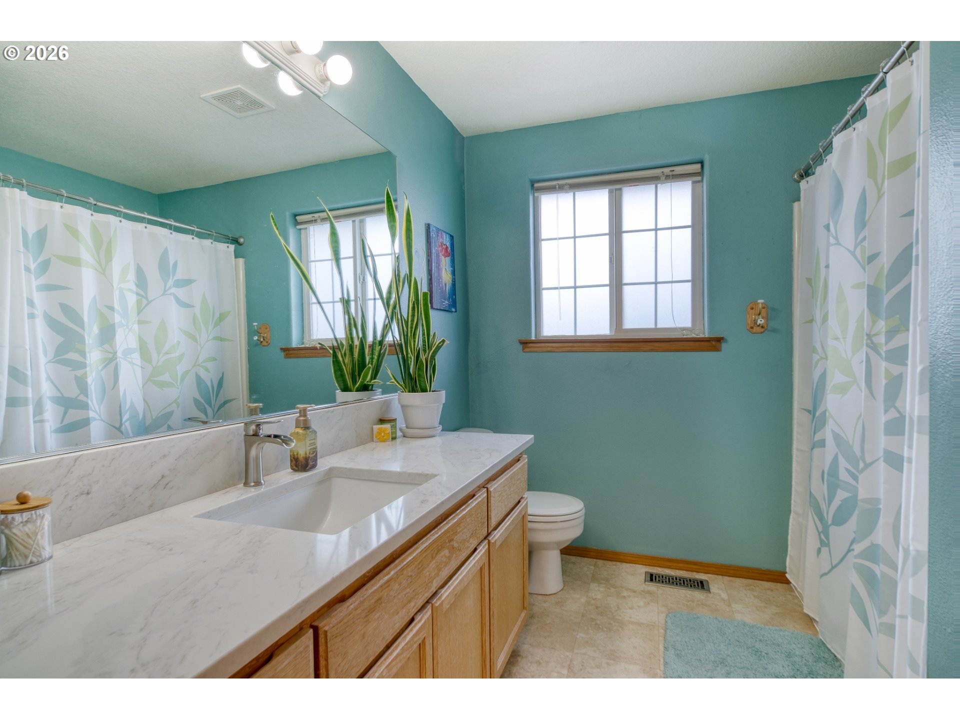 435 South 8th Street St. Helens, OR 97051 - Photo 17 of 39 a bathroom with a sink a toilet and a mirror
