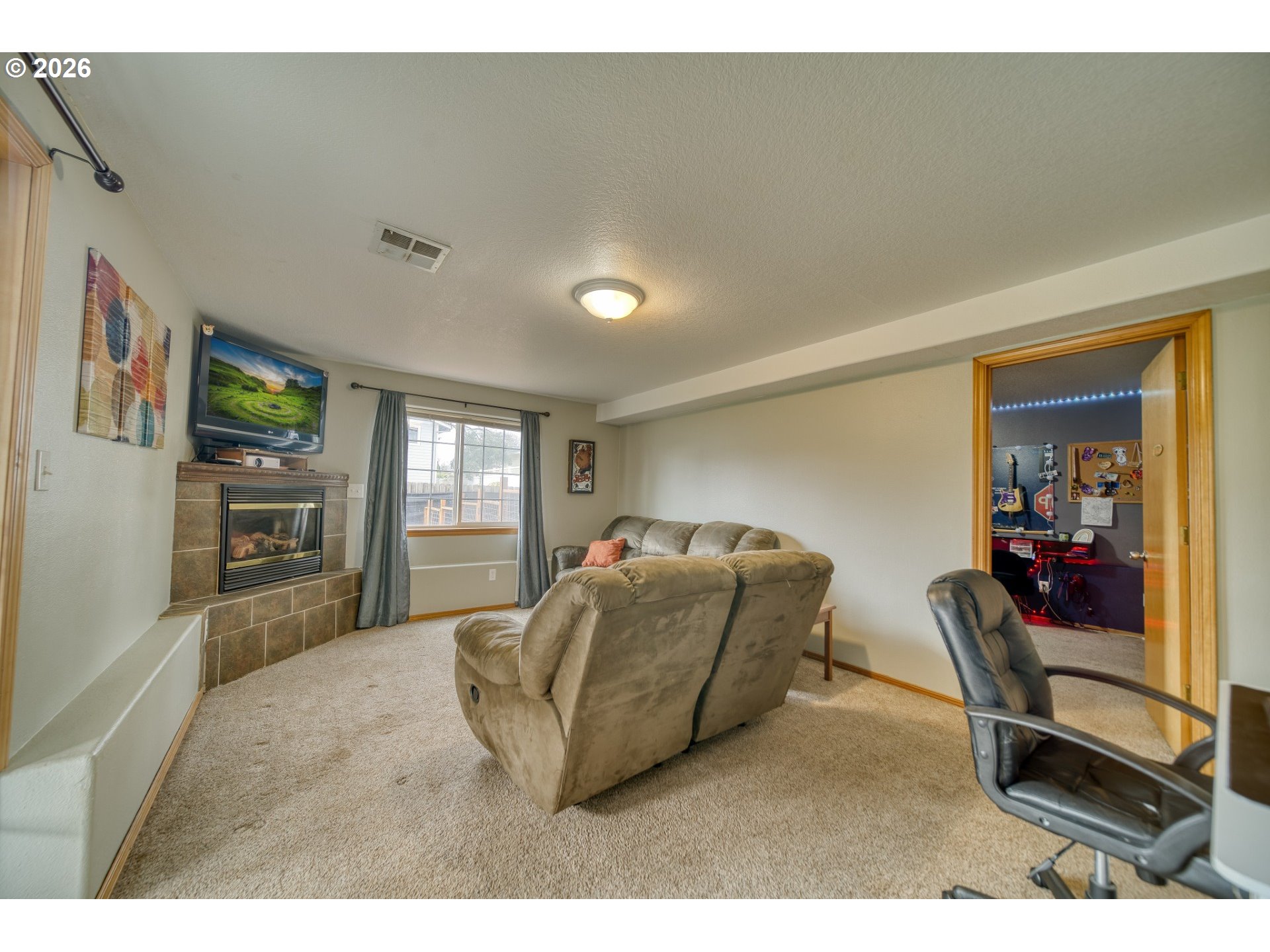 435 South 8th Street St. Helens, OR 97051 - Photo 20 of 39 a living room with furniture and a flat screen tv